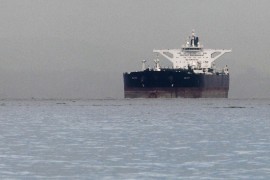 Malta-flagged Iranian crude oil supertanker "Delvar" is seen anchored off Singapore in this March 1, 2012 file photo. The United States expects countries that buy oil from Iran to further reduce their purchases if they want to avoid U.S. sanctions, a State Department source said on December 5, 2012.  REUTERS/Tim Chong (SINGAPORE - Tags: BUSINESS POLITICS ENERGY MARITIME)