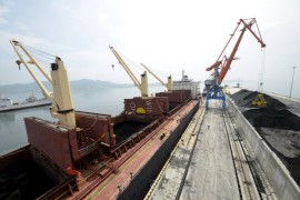 A cargo ship is loaded with coal during the opening ceremony of a new dock at the North Korean port of Rajin in this July 18, 2014 file photo. South Korea said on March 8, 2016 it would impose new sanctions against 40 individuals and 30 entities because of suspected links to North Korea's weapons programme and would ban vessels that had stopped at North Korean ports in the past 180 days.  REUTERS/Yuri Maltsev/Files
