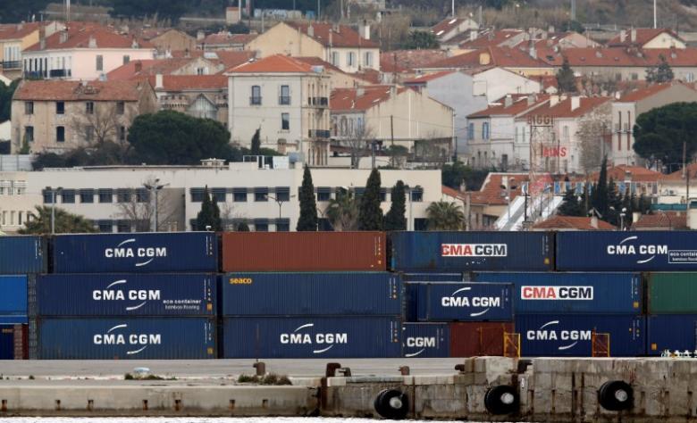 Shipping containers belonging to CMA-CGM shipping Company are seen stacked in the port of Marseille, France, March 14, 2016.   REUTERS/Jean-Paul Pelissier/File Photo