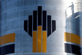 FILE PHOTO - The shadow of a worker is seen next to a logo of Russia's Rosneft oil company at the central processing facility of the Rosneft-owned Priobskoye oil field outside the West Siberian city of Nefteyugansk, Russia, August 4, 2016. REUTERS/Sergei Karpukhin/File Photo