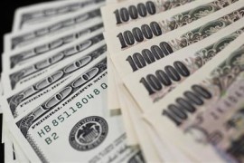A picture illustration shows U.S. 100 dollar bank notes and Japanese 10,000 yen notes taken in Tokyo August 2, 2011. REUTERS/Yuriko Nakao