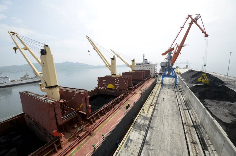 File photo of cargo ship being loaded with coal during the opening ceremony of a new dock at the North Korean port of Rajin